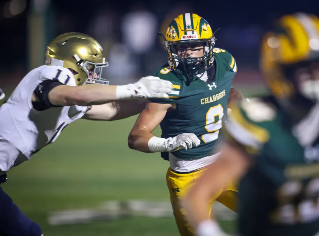 Edisonâs Samuel Edmisten, right, is grabbed by San Juan Hills...