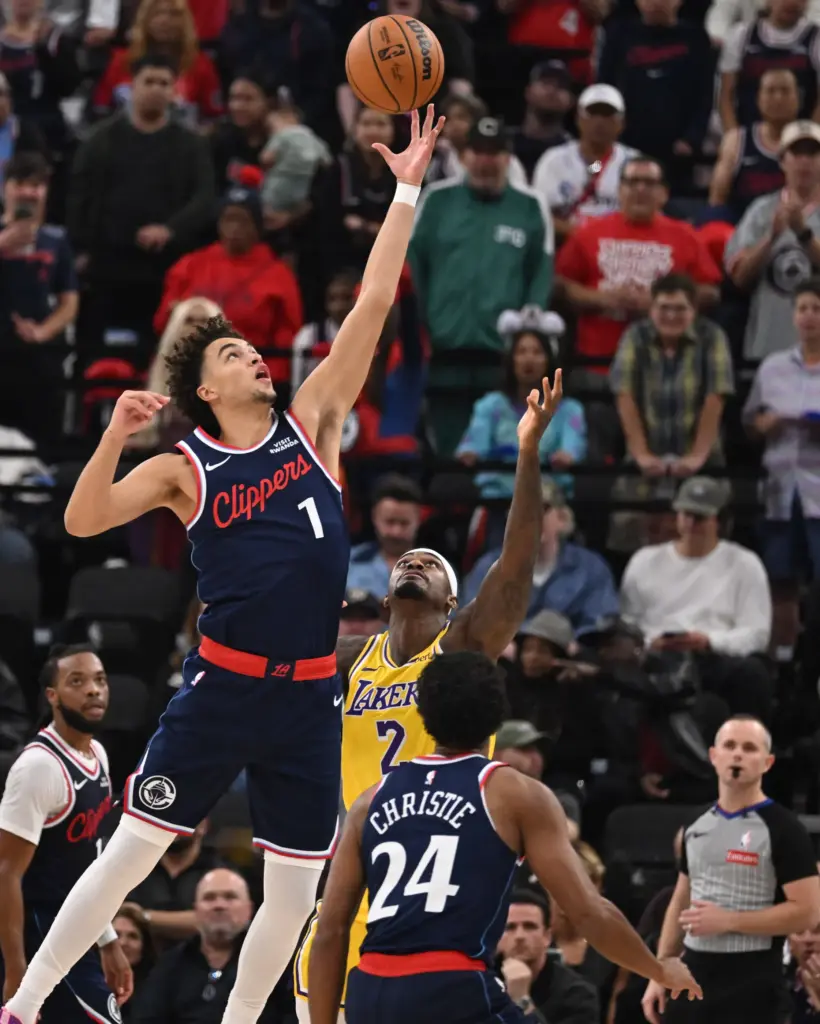 Clippers rookie guard Keaton Wagler reaches for a loose ball...