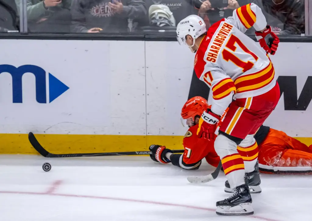 The Ducksâ Alex Killorn passes the puck as he slides...