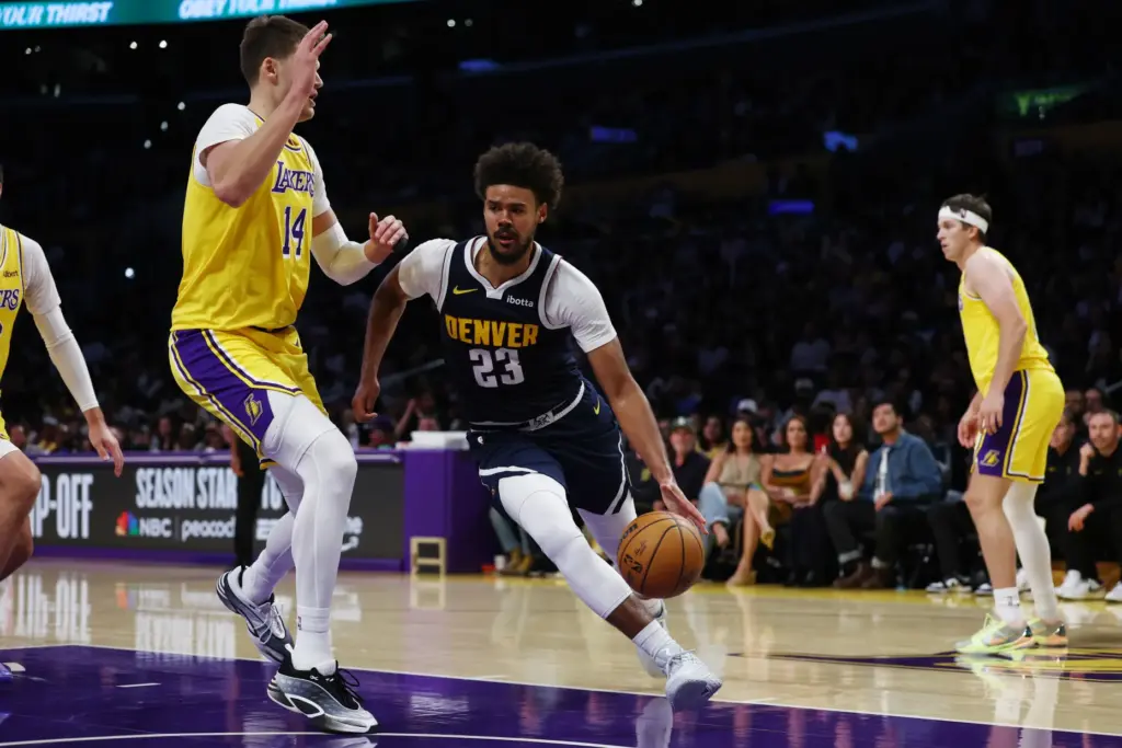Denver Nuggets forward Cameron Johnson drives to the basket during...