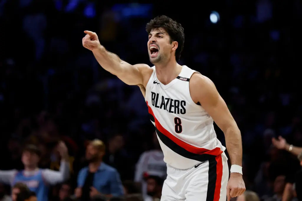 Portland Trail Blazers forward Deni Avdija yells out to a...