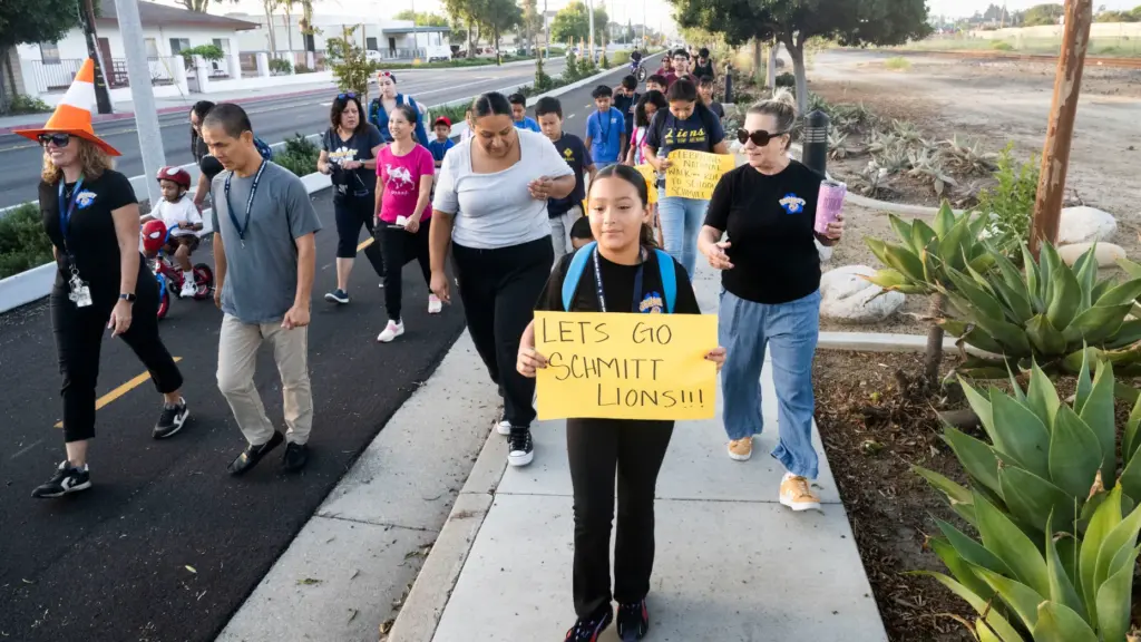 Students, parents and staff make their way to Schmitt Elementary...