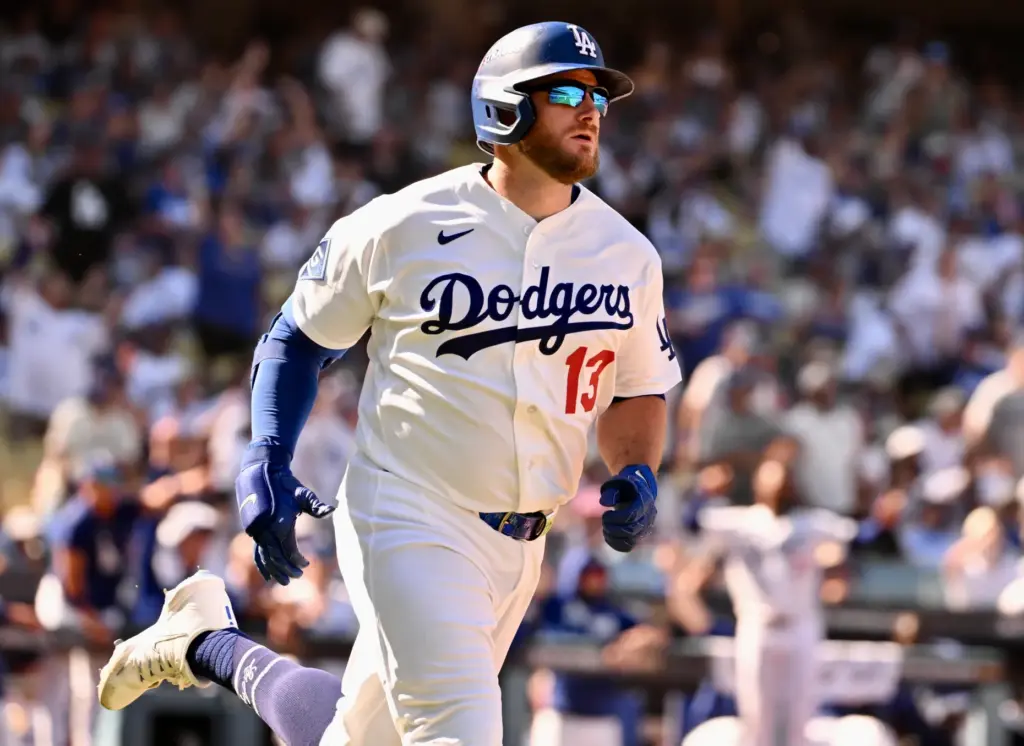 The Dodgers’ Max Muncy begins to run the bases after...
