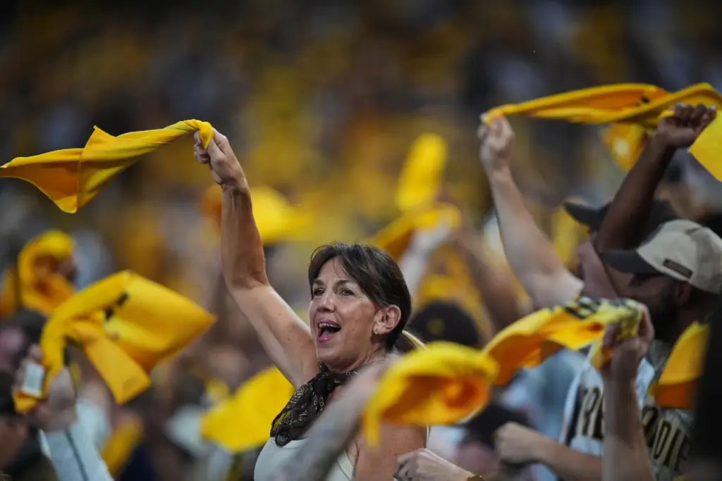 Fans cheer before the start of Game 3 of baseball’s...