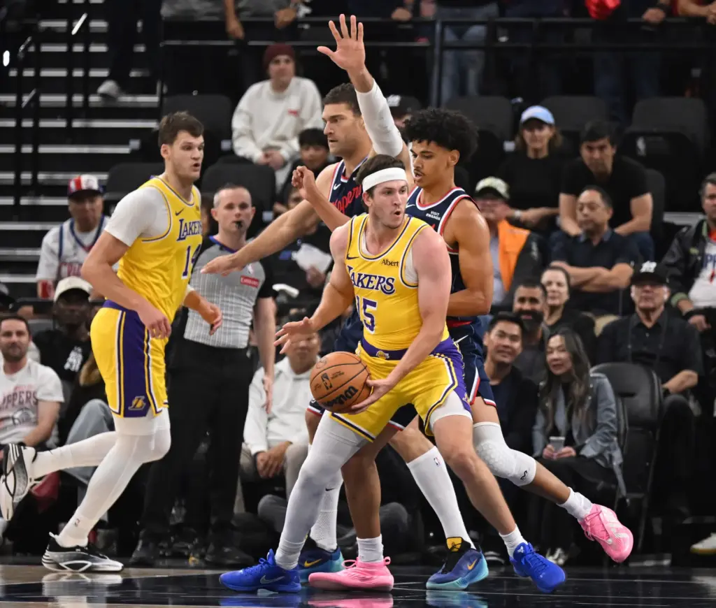 Lakers guard Austin Reaves handles the ball against as Clippers...