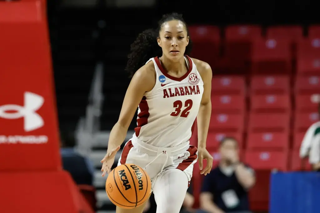 Alabama guard Aaliyah Nye brings the ball up court.