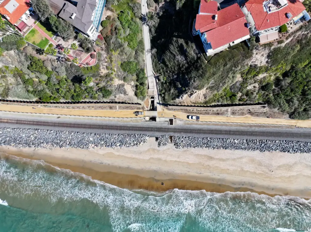 Workers put the finishing touches on the beach trail north...