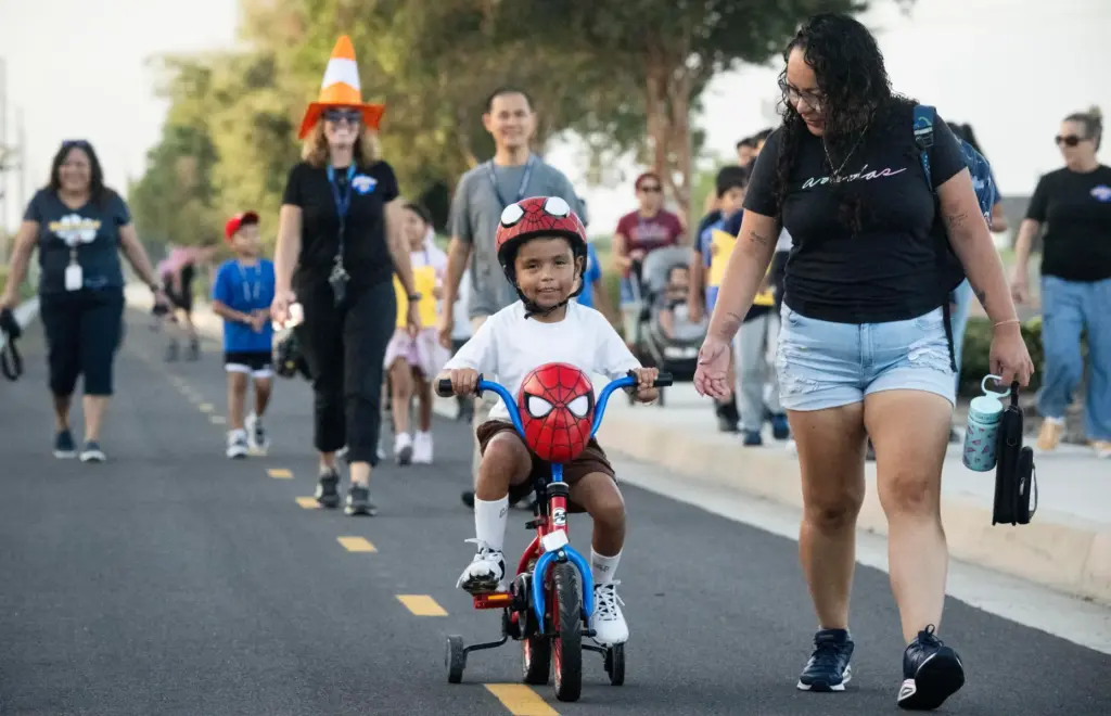 Hisao Rangel rides his Spider-Man bike with his mom Yumiko...
