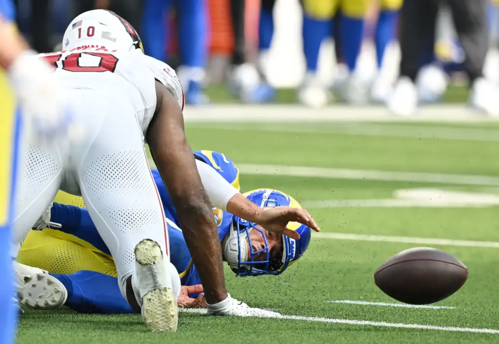 Rams quarterback Matthew Stafford (9) looks for the ball after...