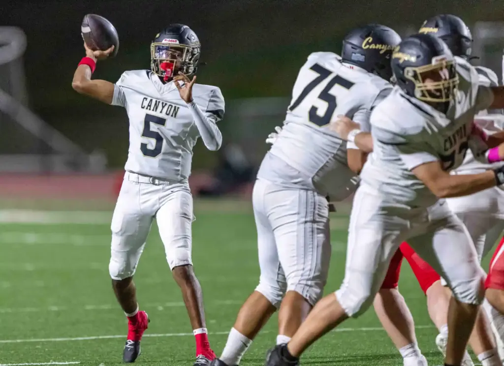 Canyon quarterback Kayden Phillips (5) throws the ball during a...