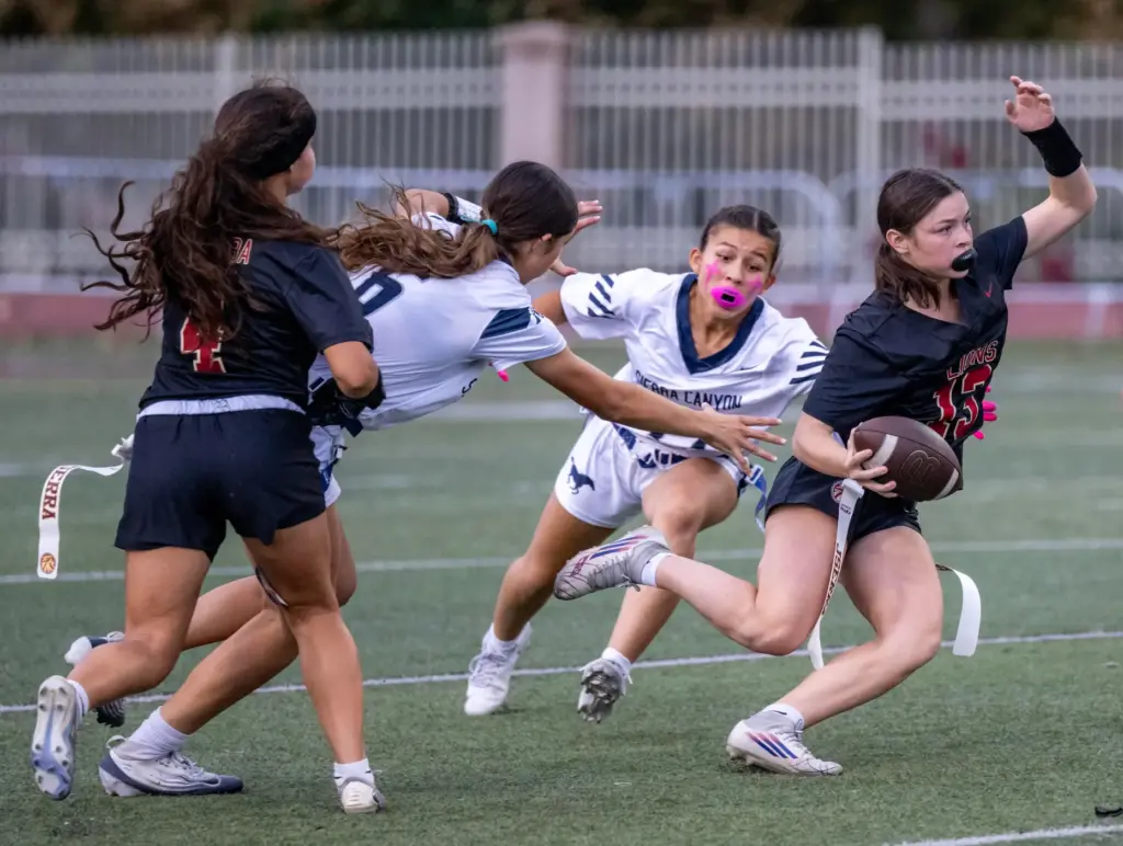 JSerra quarterback Kate Meier (13) carries the ball on a...