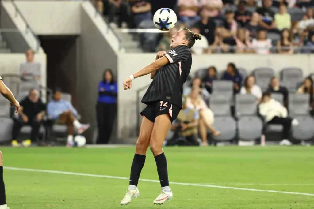 Angel City FC midfielder Carina Lageyre heads the ball against...
