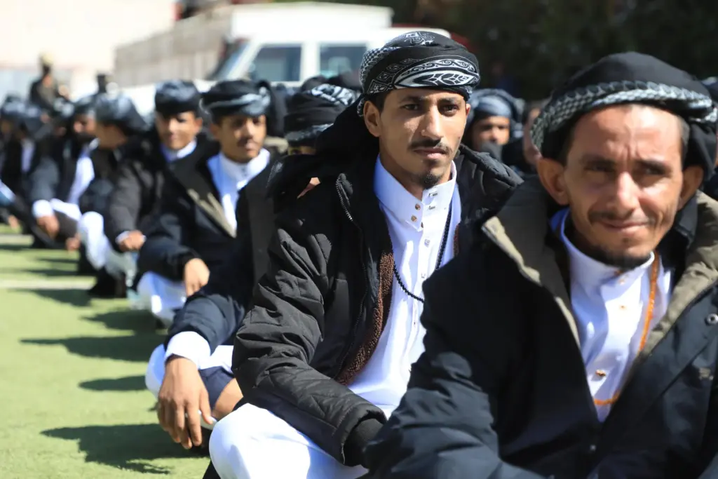 Prisoners detained in connection with Yemen's ongoing conflict line up before they are freed.