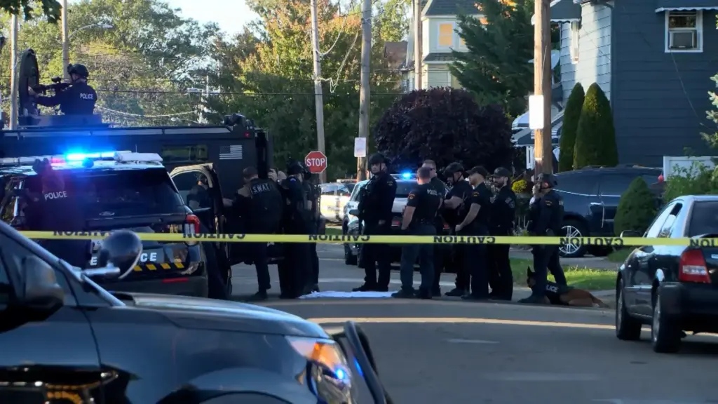 In this image from video provided by WJET, police gather...
