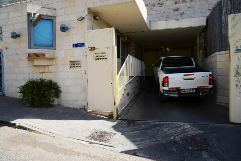 A car enters the British Consulate after the sign outside the consulate was taken down.