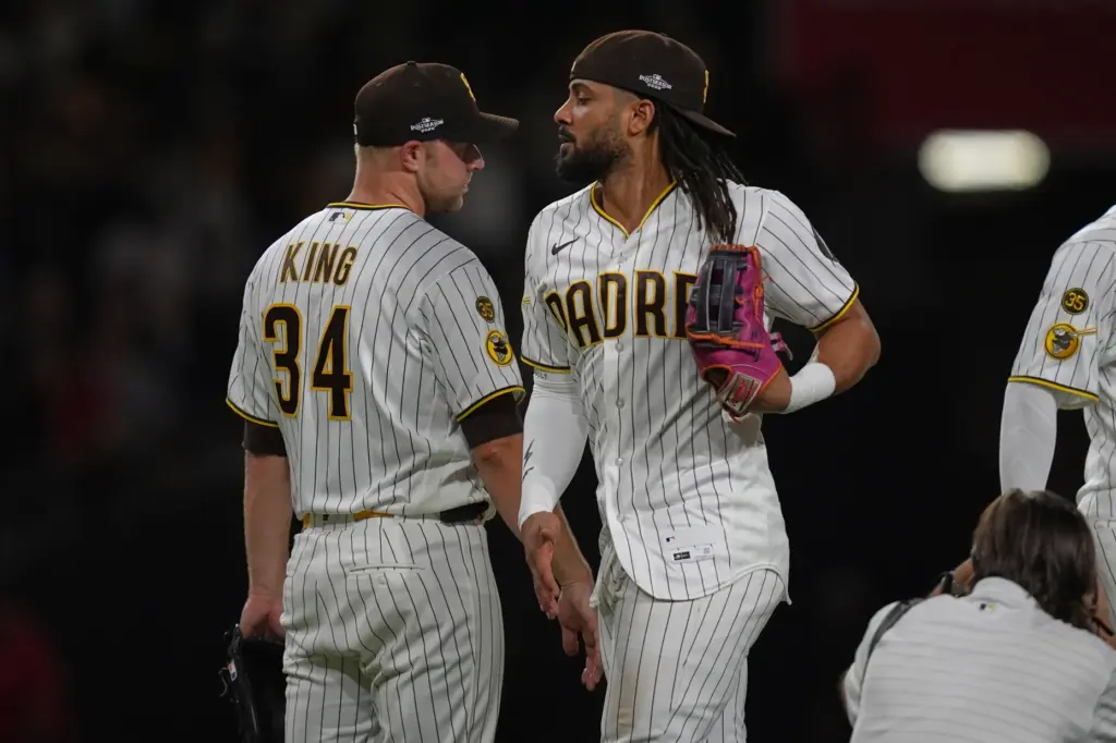 The San Diego Padres’ Fernando Tatis Jr., right, and Michael...