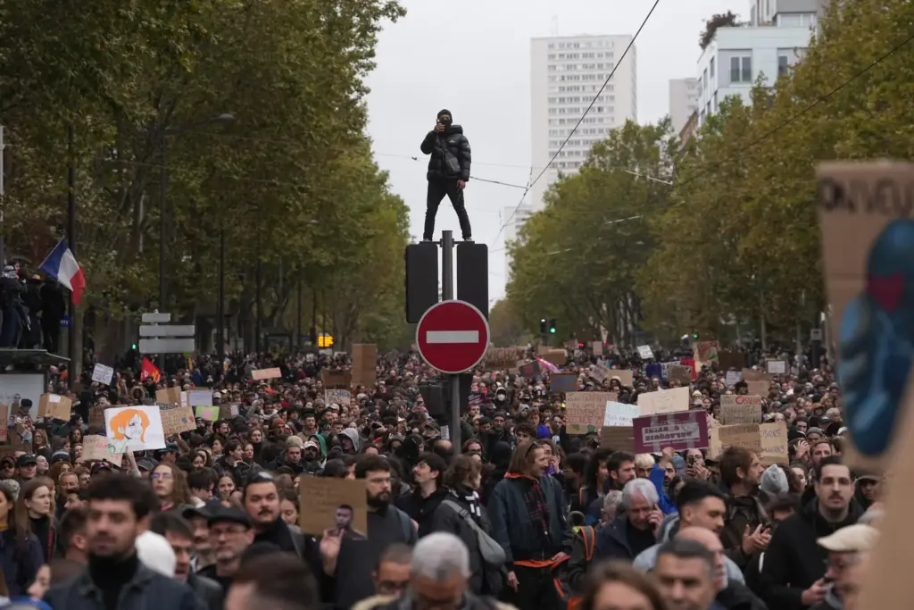 Protesters march during a demonstration against rising living costs in...