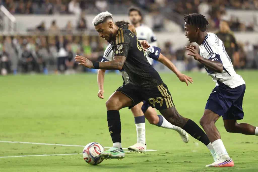 Los Angeles FC forward Denis Bouanga controls the ball against...