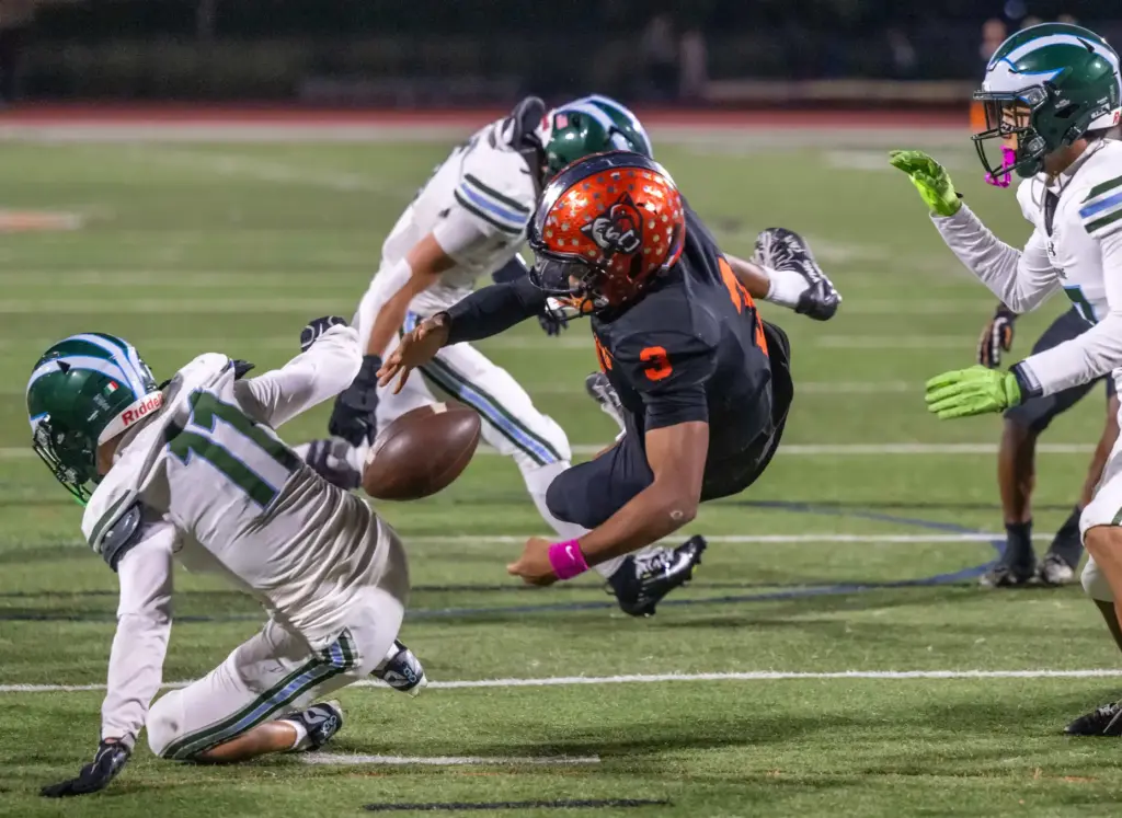 Orange quarterback Star Thomas III (3) has the ball knocked...