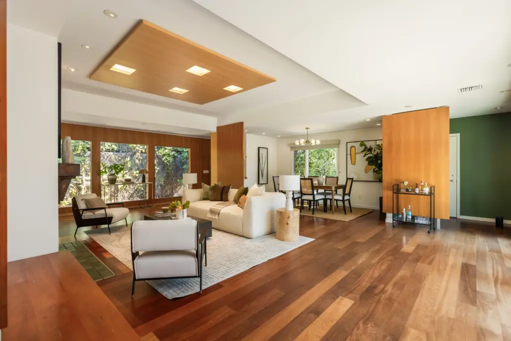 The living room flows into the formal dining room beyond....
