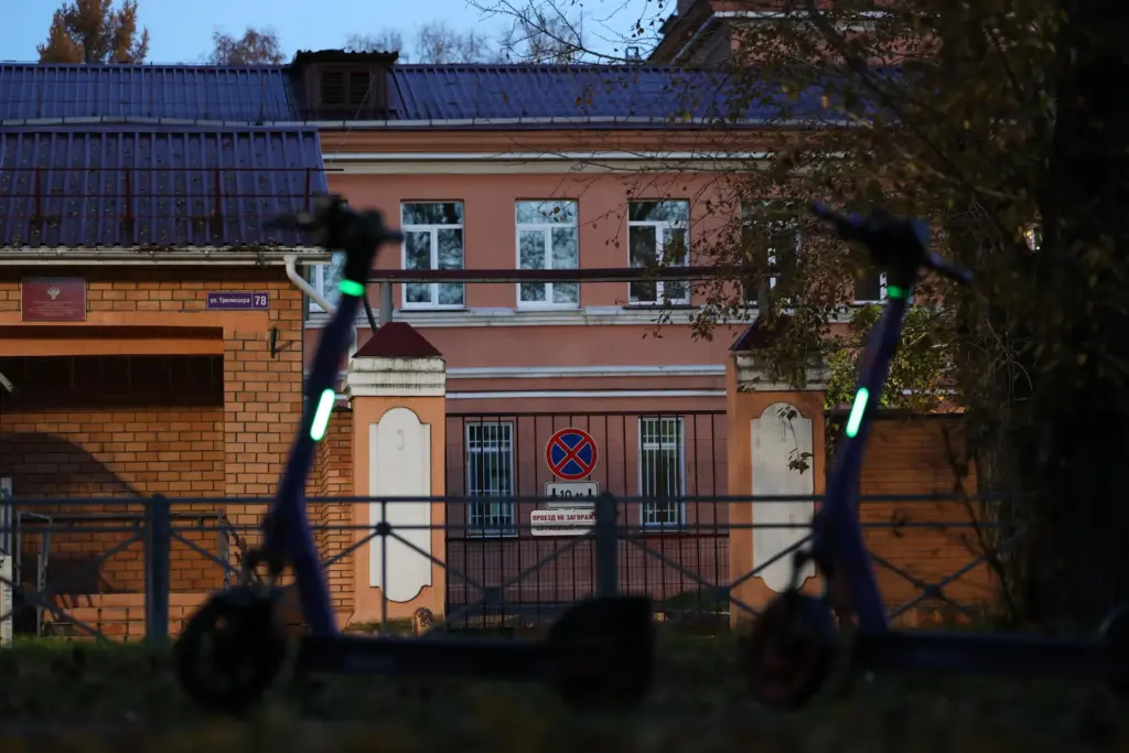 Electric scooters are parked next to the Irkutsk Anti-Plague Research Institute of Siberia.