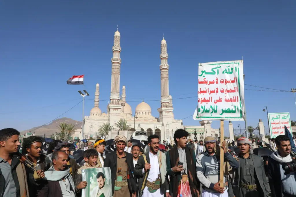 Supporters of Yemen's Houthi rebels shout slogans during a rally.