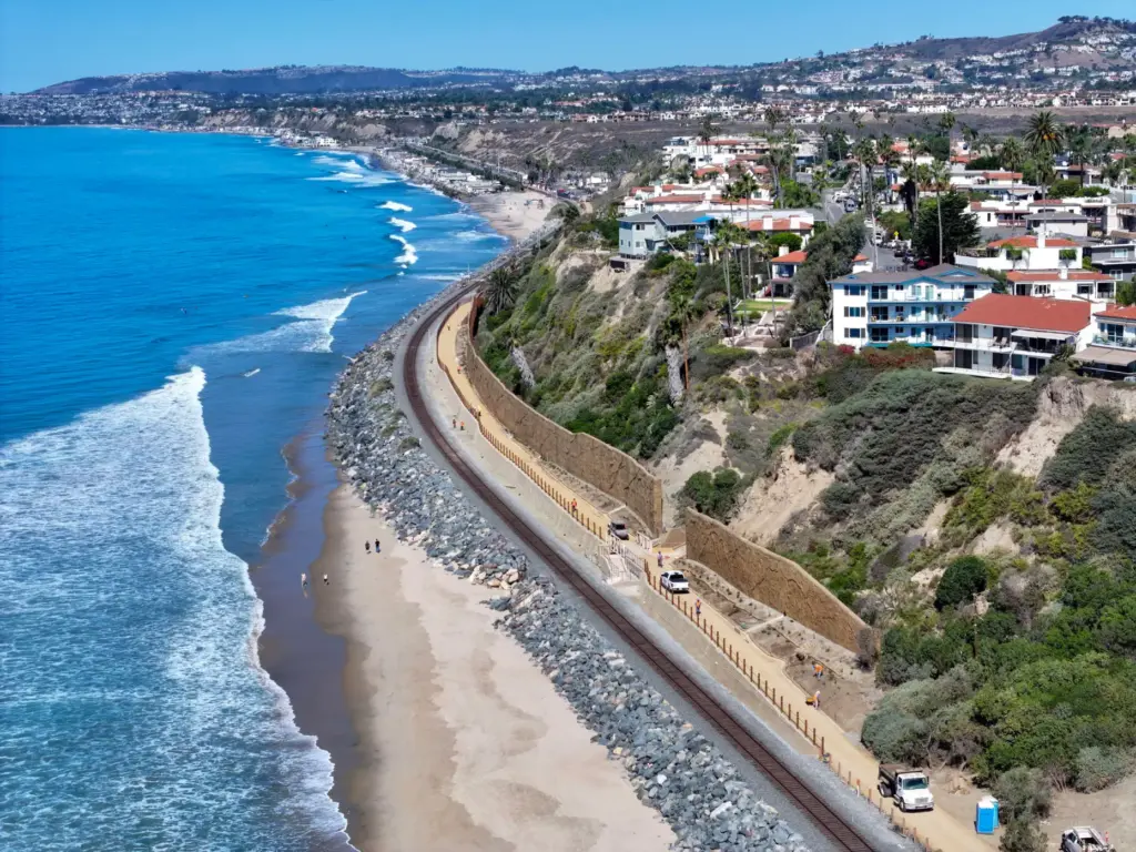 Workers put the finishing touches on the beach trail north...