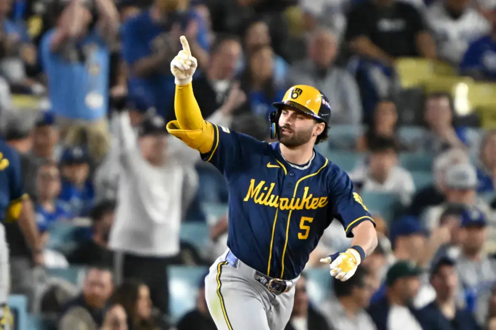 The Milwaukee Brewers’ Garrett Mitchell runs the bases after hitting...