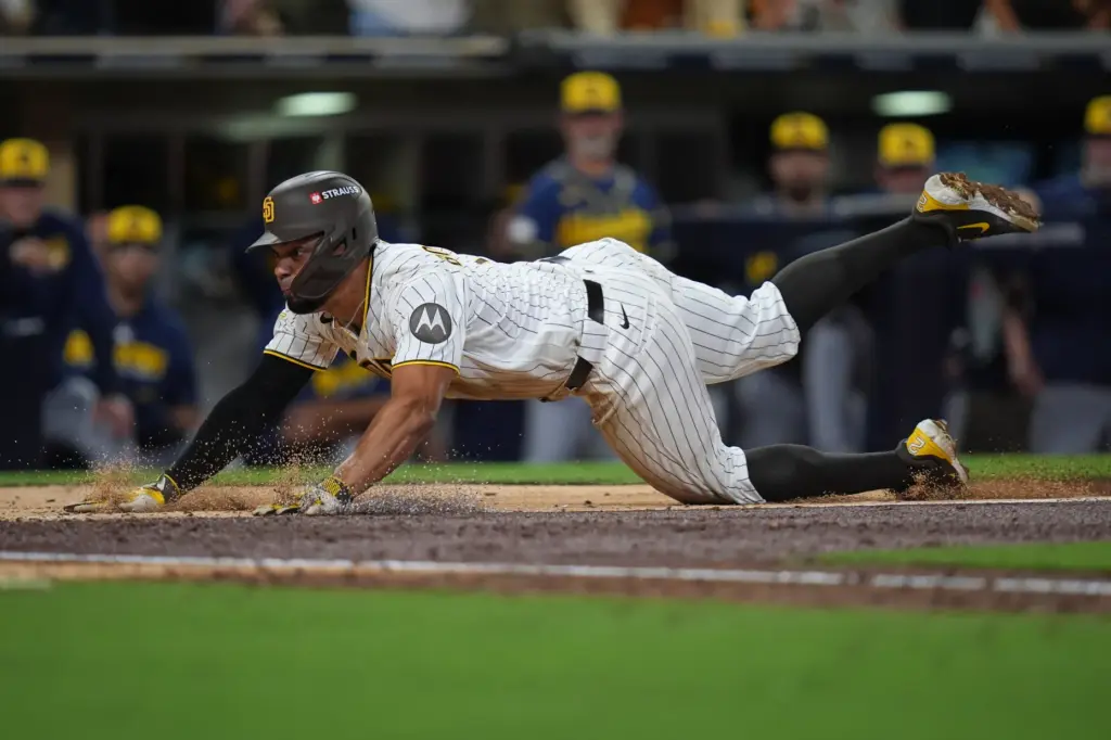The San Diego Padres’ Xander Bogaerts scores during the sixth...