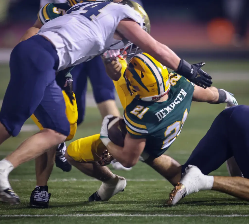 Edisonâs Brett Dempsen, right, is tackled by San Juan Hillsâ...