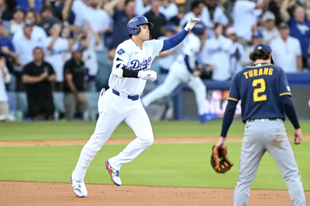 Dodgers star Shohei Ohtani runs the bases after hitting a...