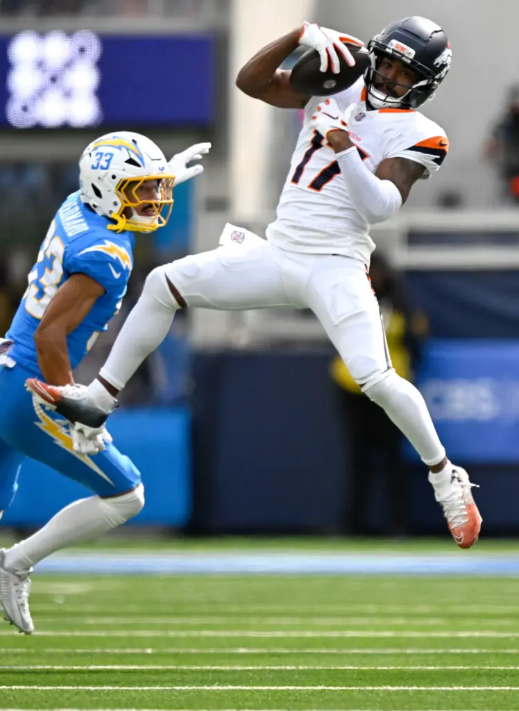 Denver wide receiver Jaylen Waddle hauls in a pass as...
