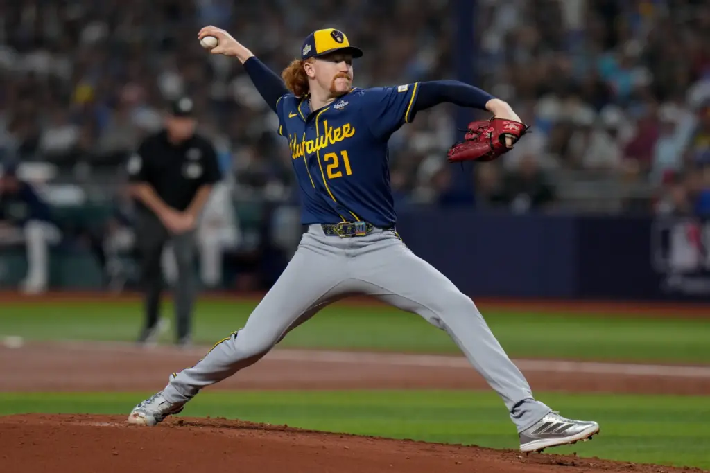 Milwaukee Brewers starting pitcher Dustin May throws to the plate...