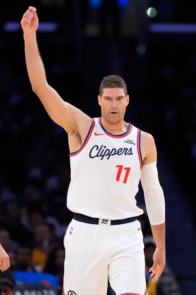 Clippers center Brook Lopez gestures after scoring during the first...