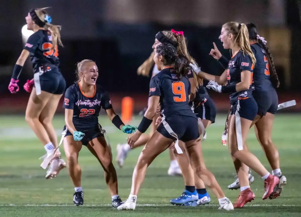 Huntington Beach players celebrate their 25-6 victory over Mater Dei...