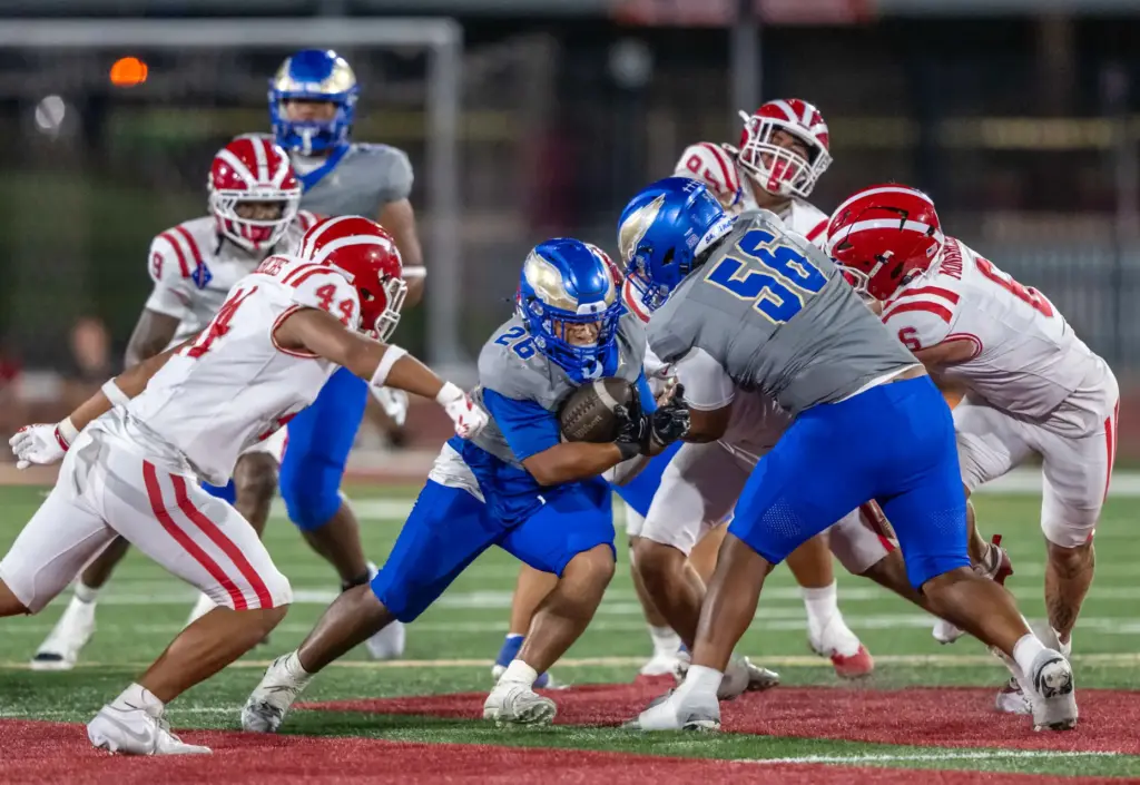 Santa Margarita running back Adrian Petero (26) carries the ball...