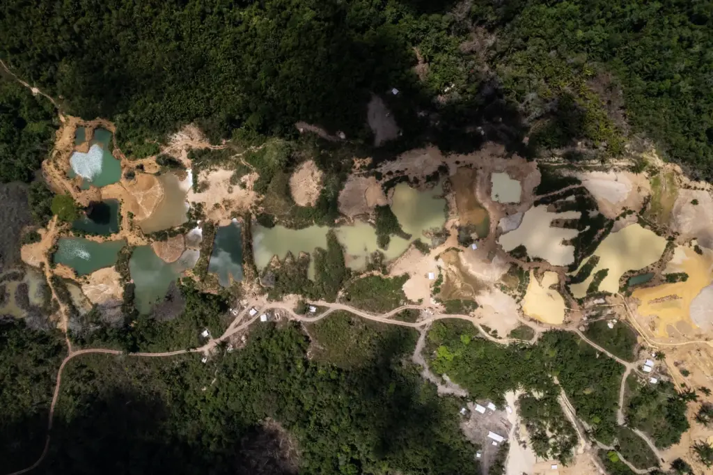Illegal mining is visible in the Saamaka territory of the...