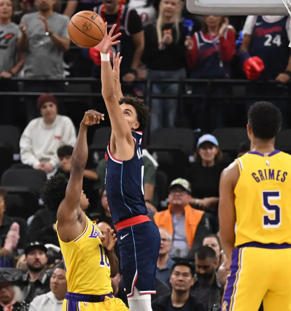 Clippers rookie guard Keaton Wagler, middle, blocks a shot by...
