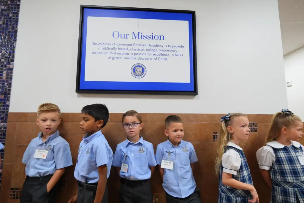 Elementary school students at Covenant Christian Academy line a hallway in Colleyville, Texas.