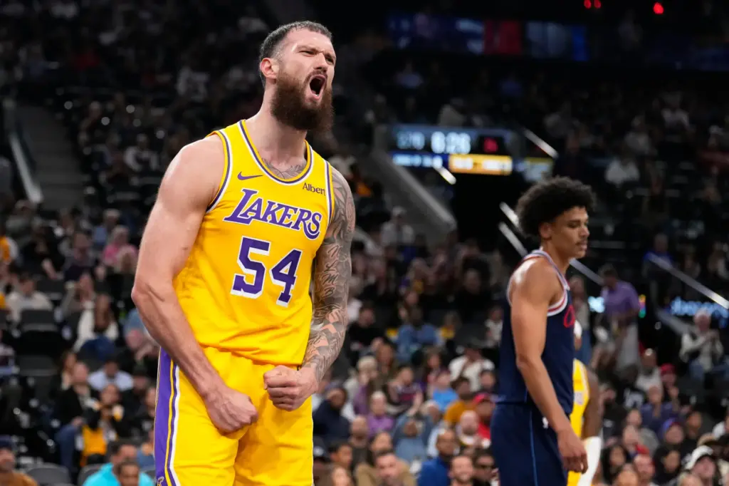 Lakers forward Sandro Mamukelashvili celebrates after scoring during the first...
