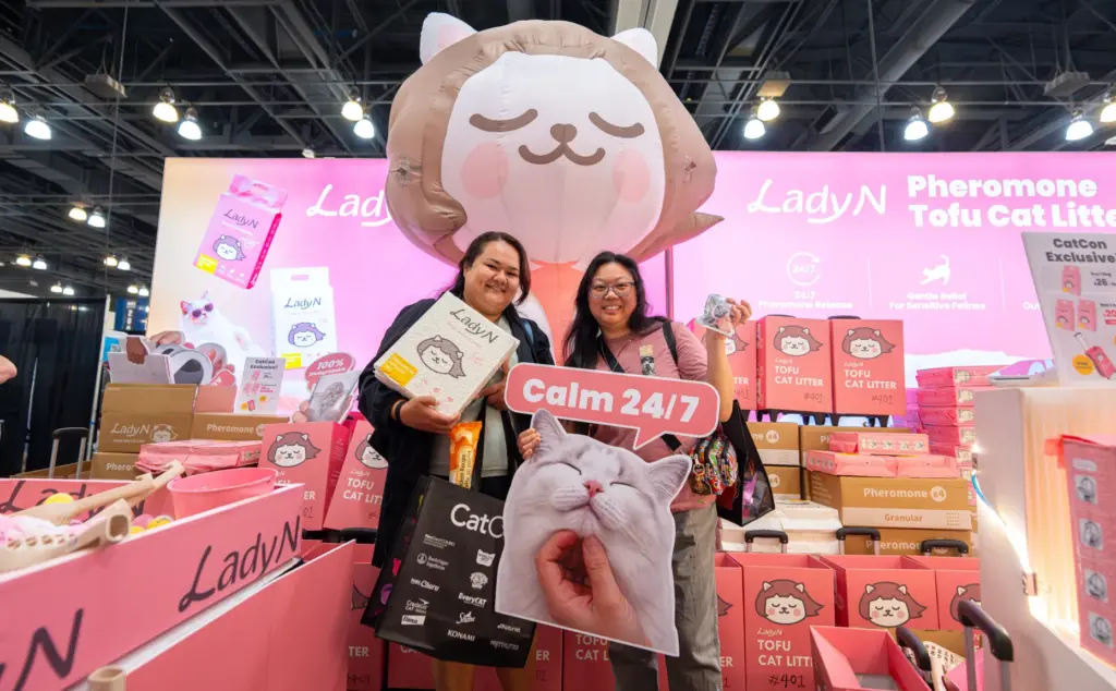 Alexandra LeFever, left, and Lisa Liem hold cat treats during...