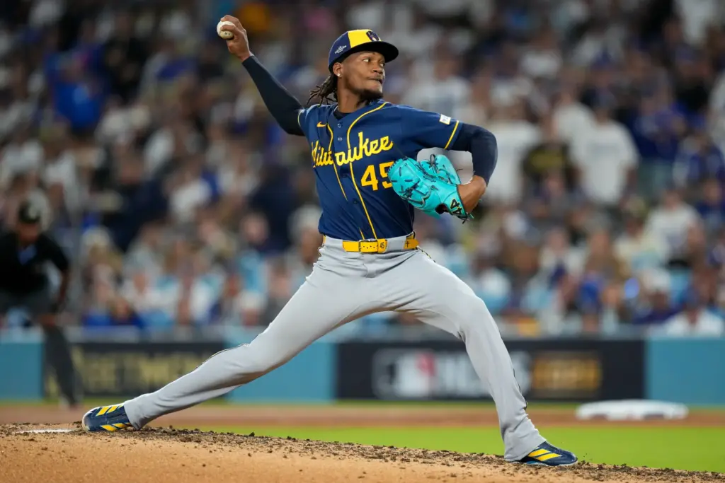 Milwaukee Brewers relief pitcher Abner Uribe throws to the plate...