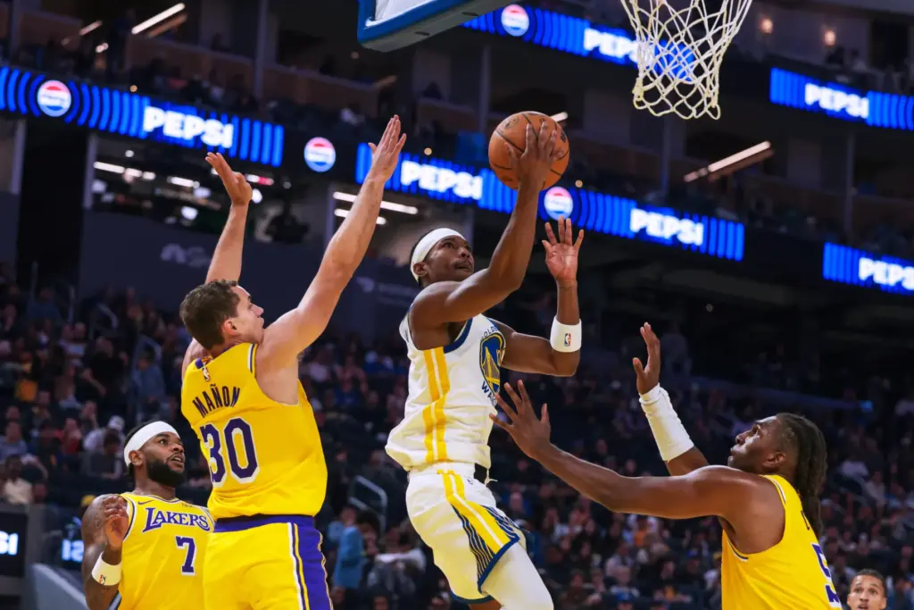 Golden State Warriors guard Brandon Williams (12) drives between Lakers...