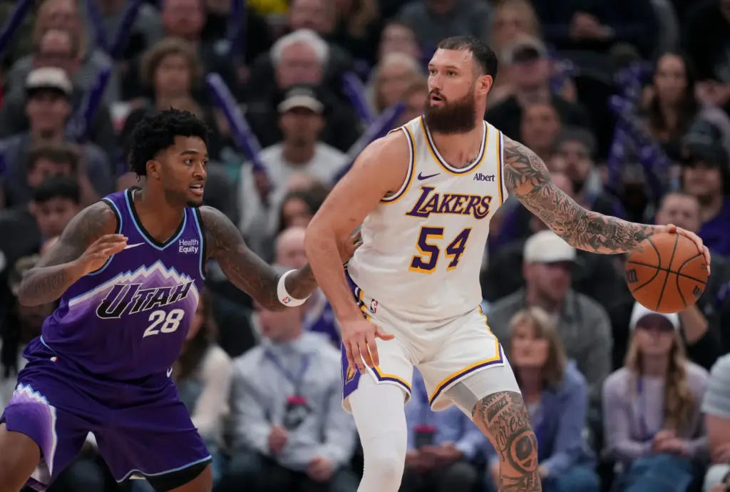 Lakers forward/center Sandro Mamukelashvili (54) dribbles as Utah Jazz forward...