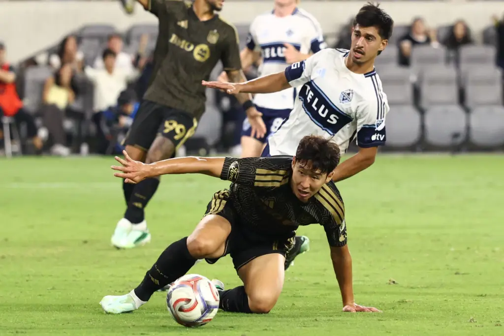 Los Angeles FC forward Son Heung-Min, bottom, losses the ball...