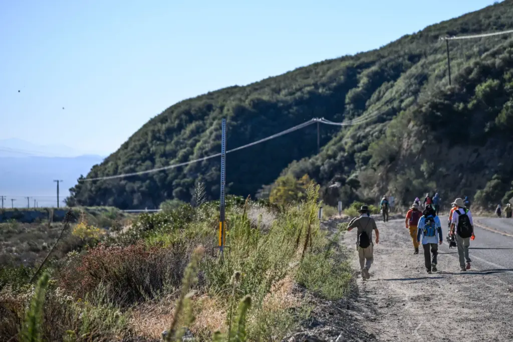 Protesters on Friday, Oct. 2, 2026, continue their 96-mile pilgrimage...