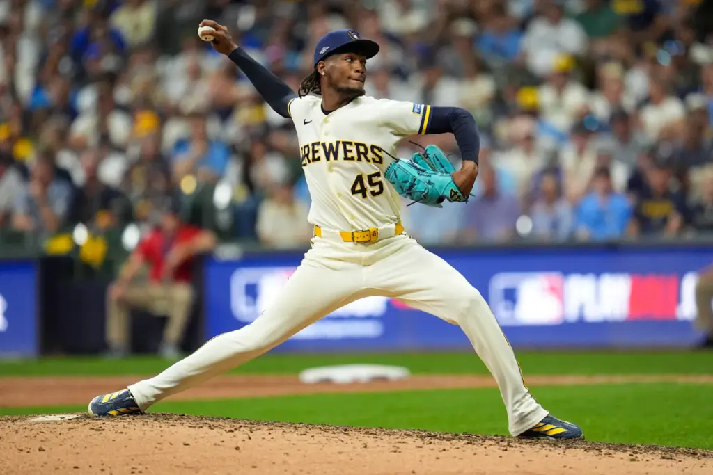 Milwaukee Brewers relief pitcher Abner Uribe throws to the plate...