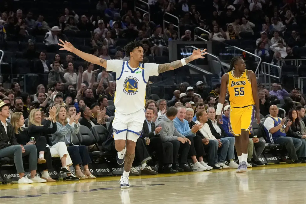 Golden State Warriors rookie forward Yaxel Lendeborg, left, gestures after...