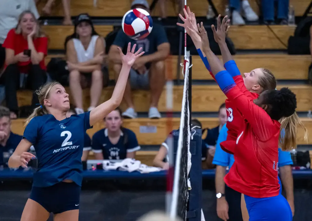 Newport Harbor outside hitter Ella Olson (2) tips the ball...