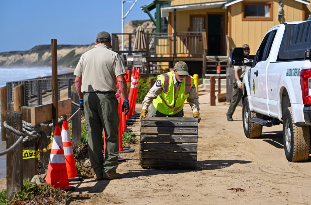 Workers ready cottages at The Historic District at Crystal Cove...